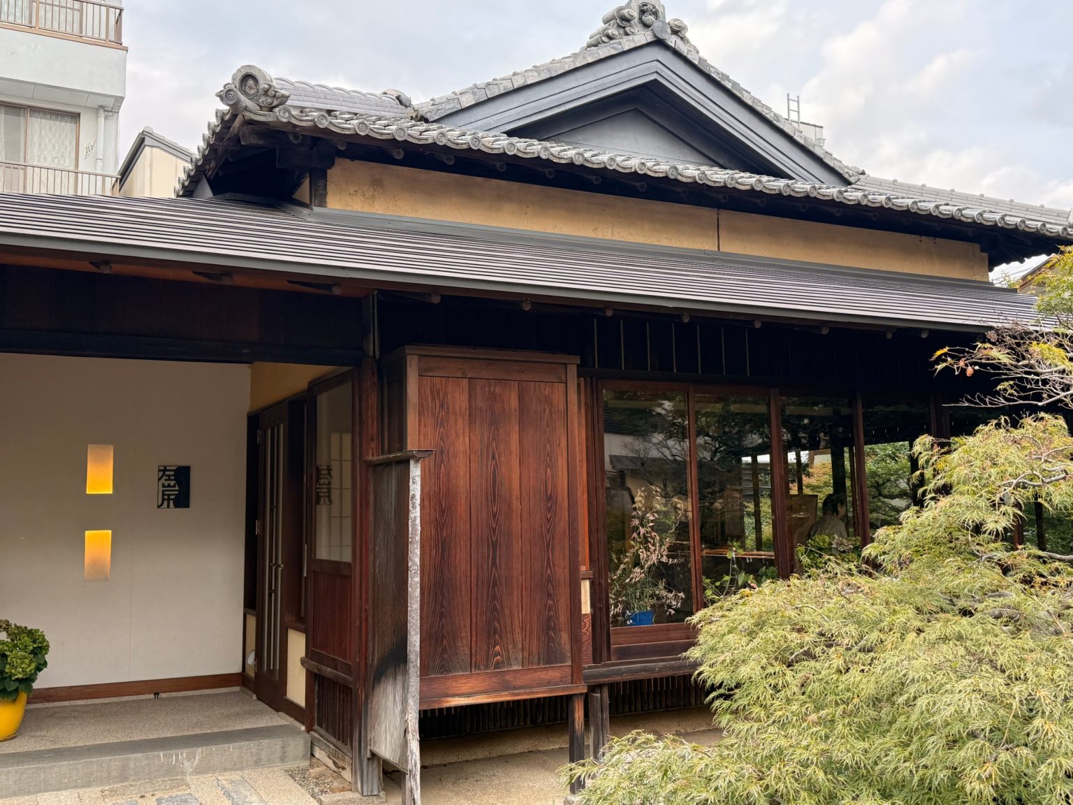 Wooden exterior and tiled roof of Sagan café, a 130-year-old house in Gifu City